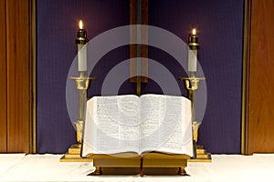 Bible and candles on altar