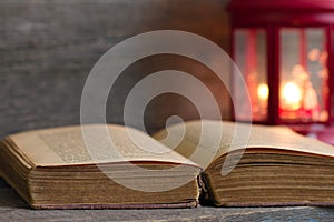 Bible and christmas lantern background concept