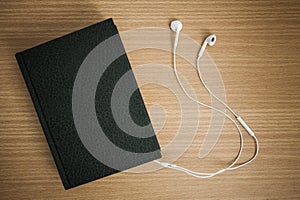 Bible connected with earphones