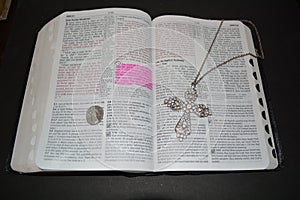 Bible with cross and gardian angle photo