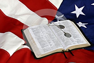 Bible with Dog Tags on US Flag