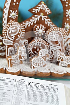 Bible and gingerbread nativity scene