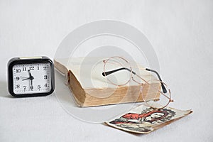 bible icon clock and glasses lie on a white background ,bible study ,religion