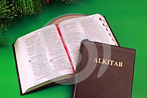 Bible Indonesian Language Alkitab Close and Open Version stacking each other Green Background