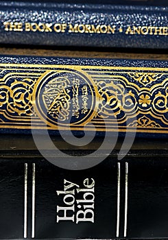 Bible and Koran (Qur'an) and Book of Mormon