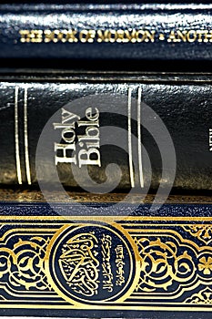 Bible and Koran (Qur'an) and Book of Mormon photo