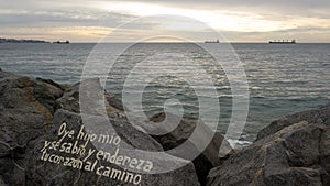 Bible message in a rock at ViÃÂ±a del Mar beach, ChileÃ¢â¬â¢s Pacific Ocean coast in a calm and beautiful sunset. photo