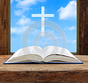 Bible open christian cross light sky view