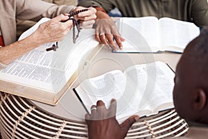 Bible, prayer group and people hands for religion support, faith and christian worship or spiritual connection. Holy