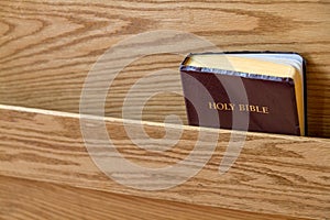 Bible in rack at church pew