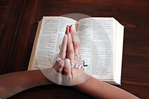 Bible and rosary beads for a catholic to pray  background with copy space