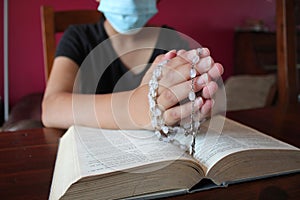 Bible and rosary beads for a catholic to pray  background with copy space