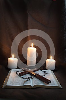 Bible, Rosary, Crucifix and Three Candles