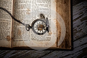 Bible and steampunk clock