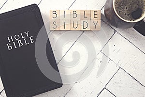 Bible Study in Block Letters on White Wooden Table with a Bible