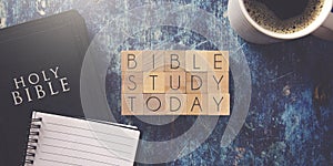 Bible Study Today Written in Block Letters on a Blue Wood Table with a Bible