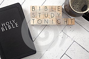 Bible Study Tonight in Block Letters on White Wooden Table with a Bible