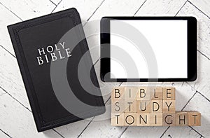 Bible Study Tonight in Block Letters on a White Wooden Table with a Black Bible and Tablet photo
