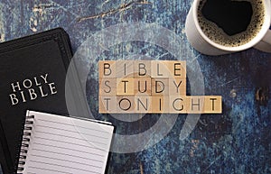 Bible Study Tonight Written in Block Letters on a Blue Wood Table with a Bible
