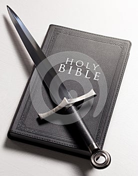 Bible and Sword on a Bright White Background