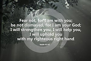 Bible verse about fear, strength, hope and love of God. On natural rays background of foggy in forest.