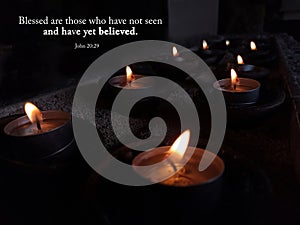 Bible verse quote - Blessed are those who have not seen and have yet believed. John 20:29 With candle lights in the night.