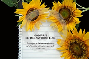 Bible verse quote - God First before anything else. Matthew 6:33 with notebook and sunflowers on black background