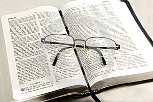 Bible whit eye glasses.