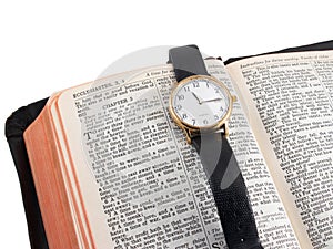 Bible and wristwatch photo