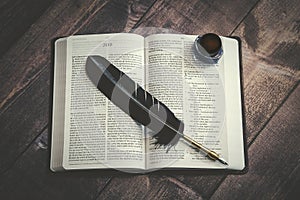 Bible with Writer`s Quill