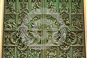 Biblical scenes on bronze door of Milan Cathedral Italy