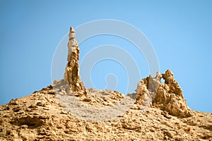 Rocky outcrop traditionally considered to be the pillar of salt from the biblical story of Lot`s Wife