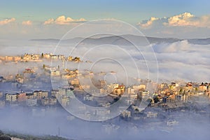 Biblical village Cana of Galilee Kafr Kanna in morning fog, Nazareth in Israel