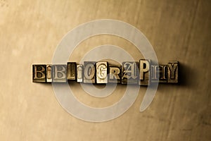 BIBLIOGRAPHY - close-up of grungy vintage typeset word on metal backdrop