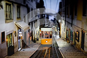 The Bica Funicular, Ascensor da Bica, Traditional yellow tram in Lisbon photo