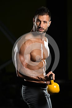 Biceps Exercise With Kettle-bell In A Gym