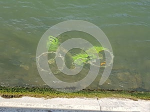 A bicycle abandoned under the water