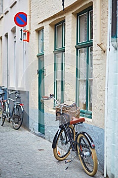 Bicycle against brick wall in Brugge