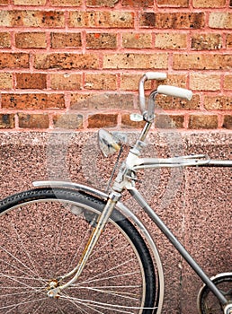 Bicycle against brick wall detail