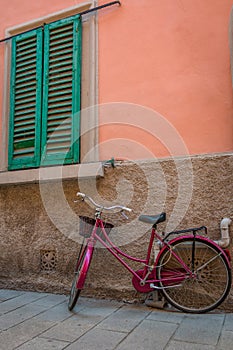 Bicycle in the backyard of the old town in Piombino, Tuscany, Italy