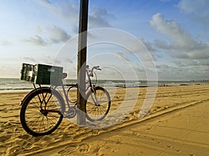 Classic bike in Recife beach, Brazil photo