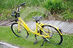 A bicycle from a bicycle sharing company illegally parked