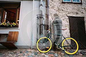 Bicycle Bike Parked Near Old Cannon On Street In Old Part European Town