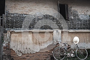 Bicycle in black and white tone on vintage wall backgroud with l