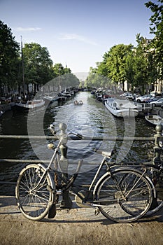 Bicycle on a bridge on a canal in Amsterdam, Netherlands