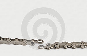 bicycle chain disconnected at the chain master link (connector pin) isolated on white background