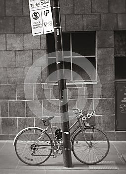 Bicycle chained to pole photo