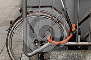 bicycle in a city on a iron railing