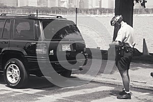 Bicycle cop writing ticket