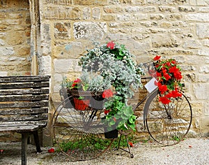 Bicycle with flowers displayed in Cotswolds photo